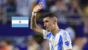 Angel Di Maria cries as he walks off the pitch with the Argentina jersey on and the Argentina flag is next to him. (Source: FIFA World Cup Español X)
