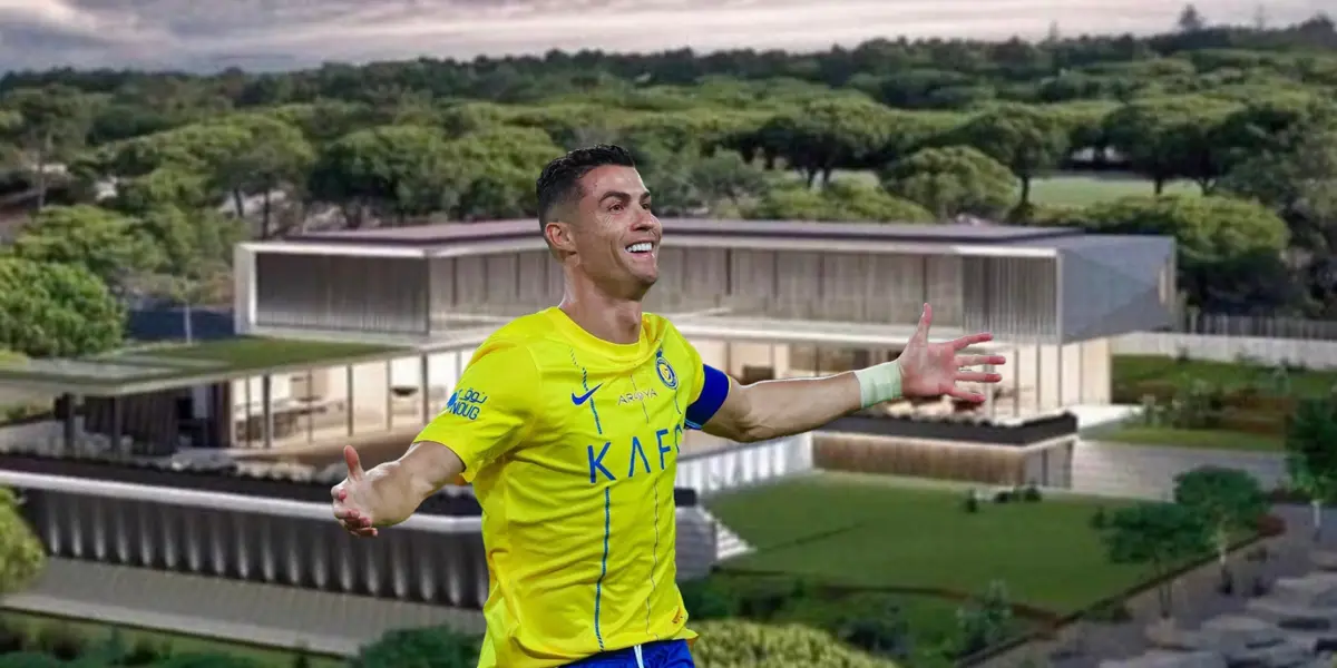 Cristiano Ronaldo celebrates an Al Nassr goal by putting his arms out wearing the jersey while a mansion is on the background.