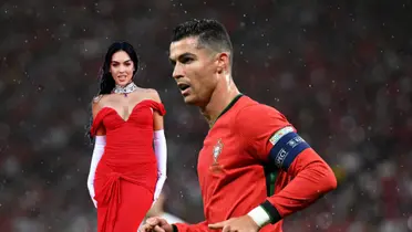 Cristiano Ronaldo jogs with a Portugal jersey on while Georgina Rodriguez wears a red dress with jewelry on. (Source: Getty Images, GOATTWORLD X)