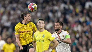 Cristiano Ronaldo looks disappointed while Sabitzer and Nacho go for the ball in the UCL Final.
