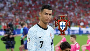 Cristiano Ronaldo looks to the side as he wears the away Portugal jersey and the Portugal national team badge is next to him. (Source: GOATTWORLD X)