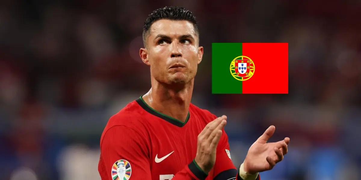 Cristiano Ronaldo looks upset as he wears the Portugal jersey and the Portugal flag is next to him. (Source: GOATTWORLD X)