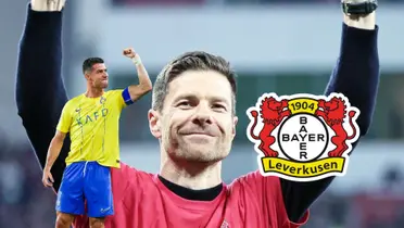 Cristiano Ronaldo puts his arm up as his celebration while Xabi Alonso smiles with Bayer Leverkusen.