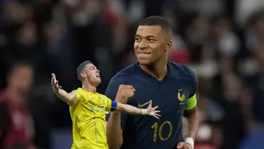 Cristiano Ronaldo screams with joy while his arms are out and Kylian Mbappé is happy while wearing the French national team jersey.