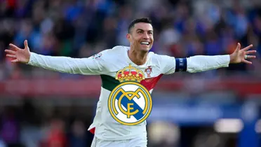 Cristiano Ronaldo smiles while wearing a white Portugal national team jersey and a Real Madrid badge is in the middle.