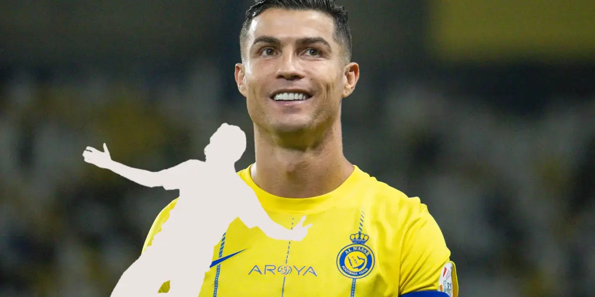 Cristiano Ronaldo smiles while wearing the Al Nassr jersey and the a mystery player is below him. (Source: GOAL)