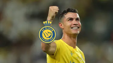 Cristiano Ronaldo smiles with his fist up and the Al Nassr badge is next to him.