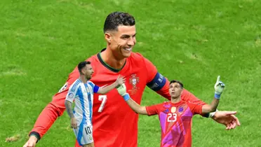 Cristiano Ronaldo smiles with the Portugal jersey on while Lionel Messi smiles with the Argentina jersey and Dibu Martinez points and looks up. (Source: Messi Xtra X, GOATTWORLD X)