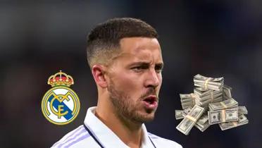 Eden Hazard is concentrated while wearing the Real Madrid jersey while a Real Madrid logo in on the left and a stack of money is on the right.