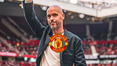 Erik Ten Hag smiles and waves to the fans while the Manchester United badge is in the middle.