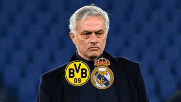 Jose Mourinho looks serious as the Borussia Dortmund and Real Madrid badges are below him.
