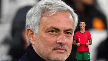 Jose Mourinho slightly grins while Cristiano Ronaldo smiles at the camera and holds on his Portugal national team jersey.