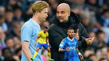 Kevin De Bruyne and Pep Guardiola discuss while Cristiano Ronaldo and Neymar wear their Saudi Pro League team: Al Nassr and Al Hilal respectively.