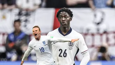 Kobbie Mainoo wears the England jersey at the EUROS while Wayne Rooney celebrates his goal for England with the number 10. (Source: Getty Images)