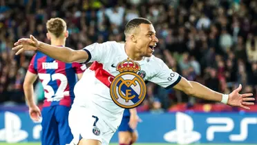 Kylian Mbappé celebrates his goal with his arms out while wearing a white PSG jersey; the Real Madrid badge is in the middle.