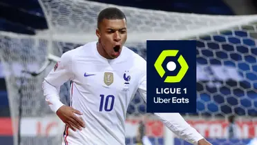Kylian Mbappé celebrates his goal with the French national team and the Ligue 1 logo is next to him.