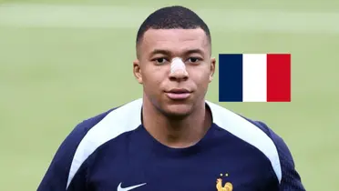 Kylian Mbappé is wearing the training kit while wearing a nose protection and the the French flag is next to him. (Source: KM10 Zone)