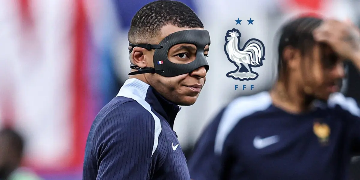 Kylian Mbappé looks to the side while he wears the black mask during training and the French national team badge is next to him. (Source: Centre Goals X)