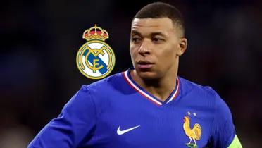 Kylian Mbappé looks to the side while wearing the French national team; the Real Madrid badge is next to him.