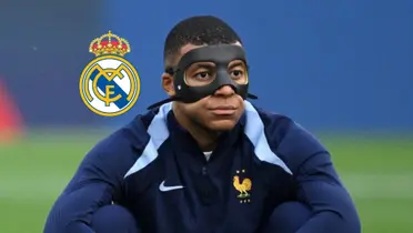 Kylian Mbappé looks upset as he sits on the ground with a black mask and the Real Madrid badge is next to him. (Source: Madrid Xtra X)