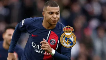 Kylian Mbappé slightly smiles while wearing the PSG jersey and the Real Madrid badge is next to him.