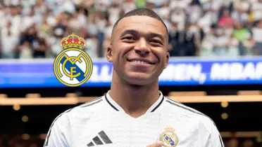 Kylian Mbappé smiles as he wears the Real Madrid jersey and the badge is next to him. (Source: Real Madrid X)