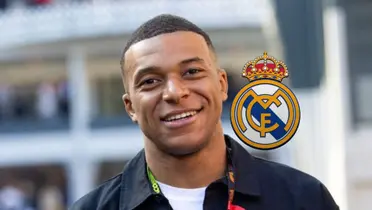 Kylian Mbappé smiles while the Real Madrid badge is next to him.