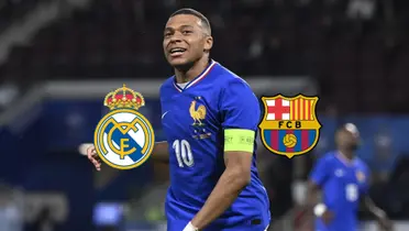 Kylian Mbappé smiles while wearing the French national team jersey and the Real Madrid and FC Barcelona badges are next to him.