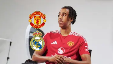 Leny Yoro sits on a chair while wearing the Manchester United jersey as the Man United and the Real Madrid badges is to the side of him. (Source: Centre Devils X)