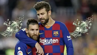 Lionel Messi and Gerard Pique hug each other while wearing the 2019/20 FC Barcelona jersey; flying bills are next to them.