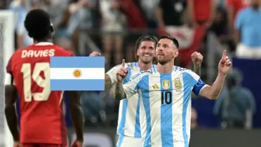 Lionel Messi celebrates his goal for Argentina as he wears the national team jersey while the Argentina flag is next to him. (Source: Getty Images)