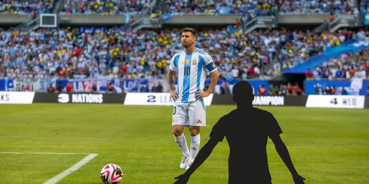 Lionel Messi has his hands on his hips while wearing the Argentina national team jersey and a mystery player is next to him.