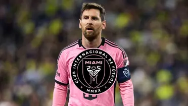 Lionel Messi looks on while wearing an Inter Miami jersey; the Inter Miami badge is in the middle.