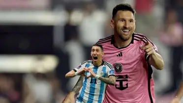Lionel Messi smiles while wearing an Inter Miami jersey and Angel Di Maria celebrates with a heart gesture with his hands, while wearing the Argentina jersey.