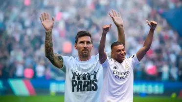 Lionel Messi waves to the crowd while presented at PSG while Kylian Mbappé wears the Real Madrid jersey for the first time. (Source: EPA Photo)