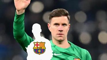 Marc-Andre ter Stegen puts his hand up in the air, wearing the FC Barcelona goalkeeper kit, while a mystery person has the Barca badge.