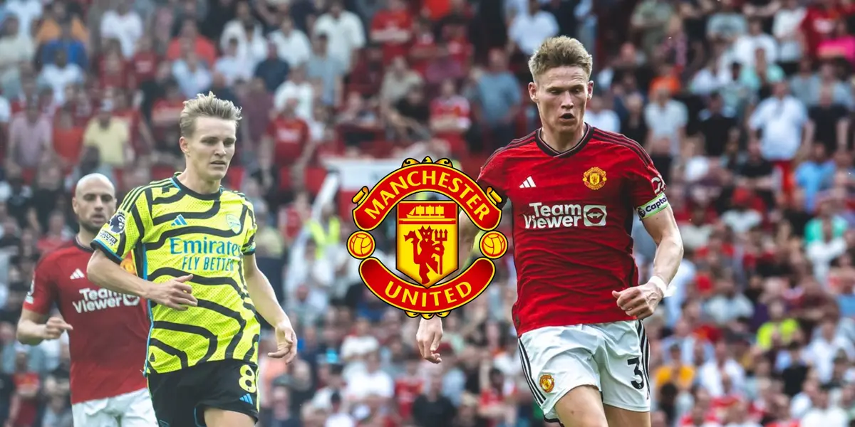 Martin Odegaard and Scott McTominay look at the ball in the Man United vs Arsenal match.