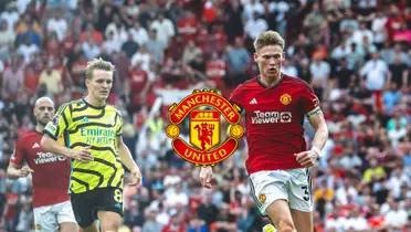 Martin Odegaard and Scott McTominay look at the ball in the Man United vs Arsenal match.