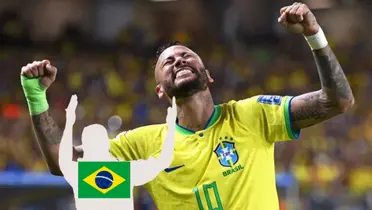 Neymar Jr. closes his eyes and puts his fists in the air while wearing the Brazil jersey and a mystery player is below him with the Brazil flag. (Source: Forbes)