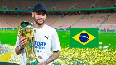 Neymar Jr holds the King's Cup trophy while the Brazil flag is next to him.