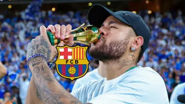 Neymar Jr kisses a mini replica of the King's Cup trophy while the FC Barcelona badge is next to him.