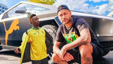 Neymar Jr. poses in front of a Puma Tesla Cybertruck and Vinicius shows off the Brazil retro jersey. (Source: Neymar Jr. X, Madrid Zone X)