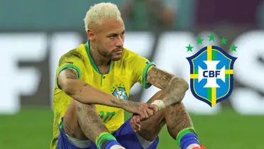 Neymar Jr. sits on the ground upset while wearing the Brazil national team kit; the Brazil national team badge is next to him.