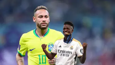Neymar looks serious while wearing the Brazilian national team jersey and Vinicius Jr. bites his Champions League medal.