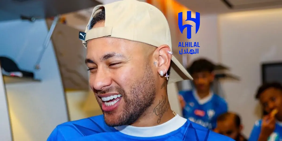 Neymar smiles while wearing a hat and the Al Hilal jersey. The Al Hilal badge is next to him.