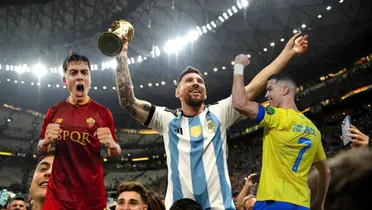Paulo Dybala shouts with an AS Roma jersey while Lionel Messi lifts the World Cup trophy with an Argentina jersey; Cristiano Ronaldo smile with a fist up & an Al Nassr jersey.