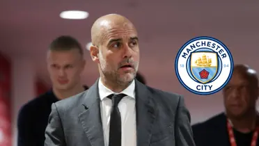 Pep Guardiola looks to his right while wearing a tuxedo; the Manchester City badge is next to him.