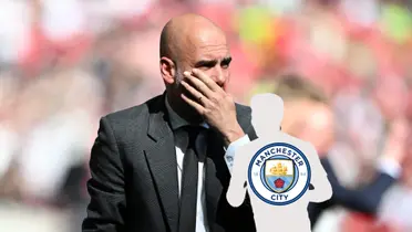 Pep Guardiola looks worried and covers his mouth with his hand; a mystery player has the Manchester City badge on him.