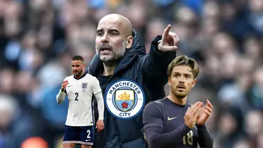 Pep Guardiola points while the Manchester City badge is below him. Kyle Walker and Jack Grealish are wearing the English jersey's.
