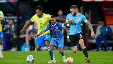 Rodrygo dribbles with the ball against Uruguay's Nahitan Nandez while Neymar dribbles with the ball in an Al Hilal jersey. (Source: Lucas Peltier-USA TODAY Sports, Al Hilal X)